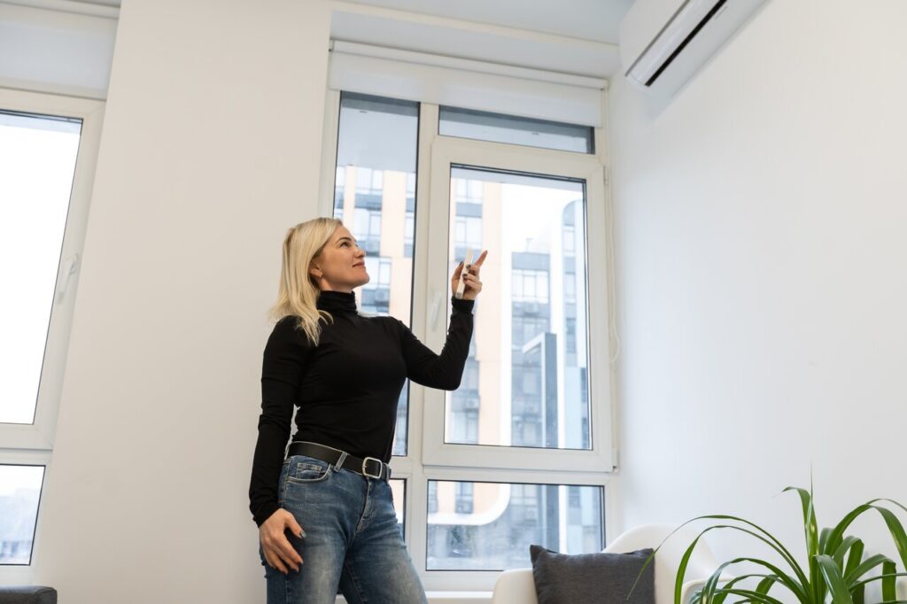 Top Benefits of Improving Indoor Air Quality in Central Florida 3 rsz air conditioner inside the room with woman operati 2023 11 27 05 20 39 utc